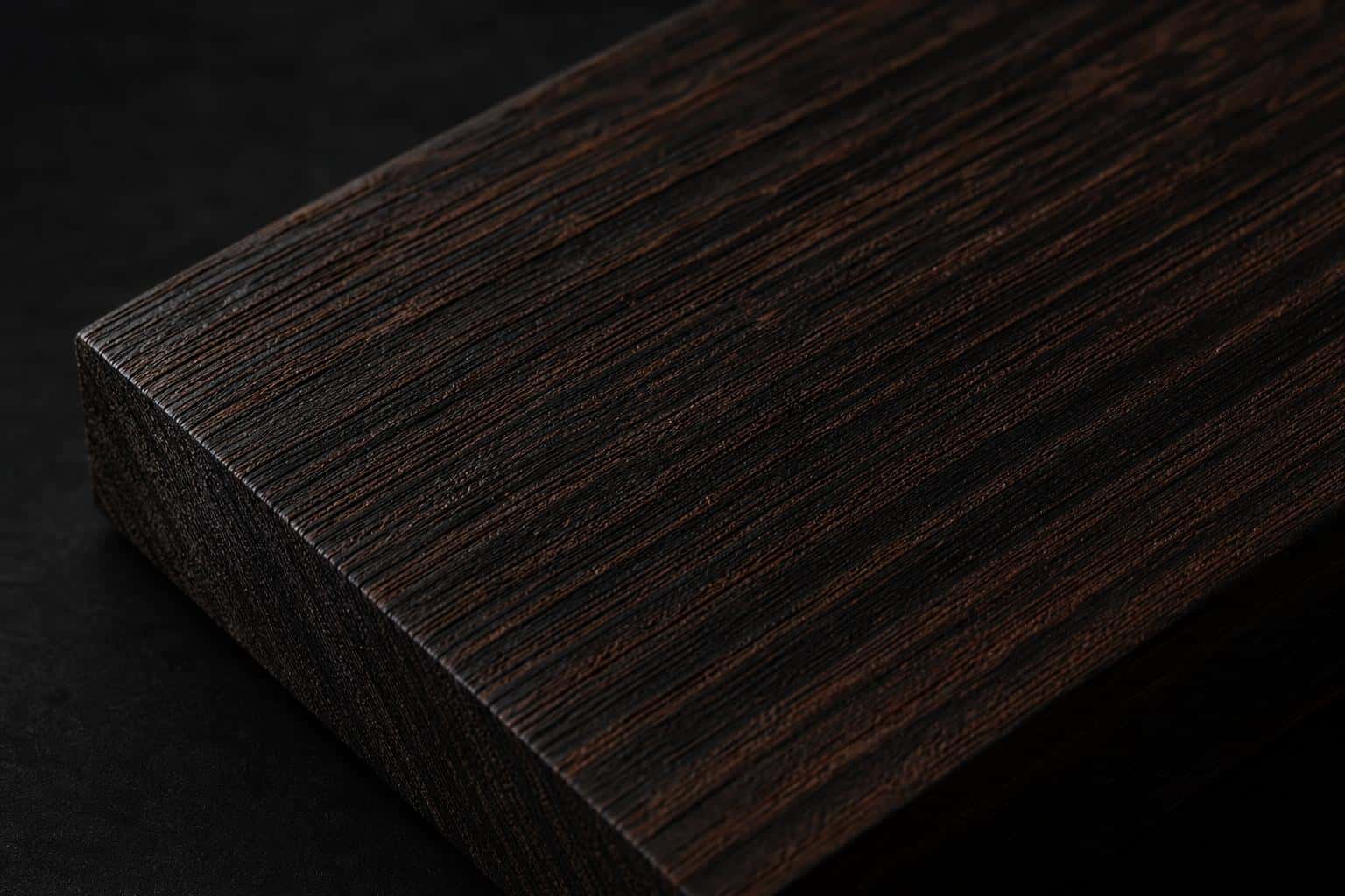 Wenge board, close-up of its dark brown, straight-grained face and edge