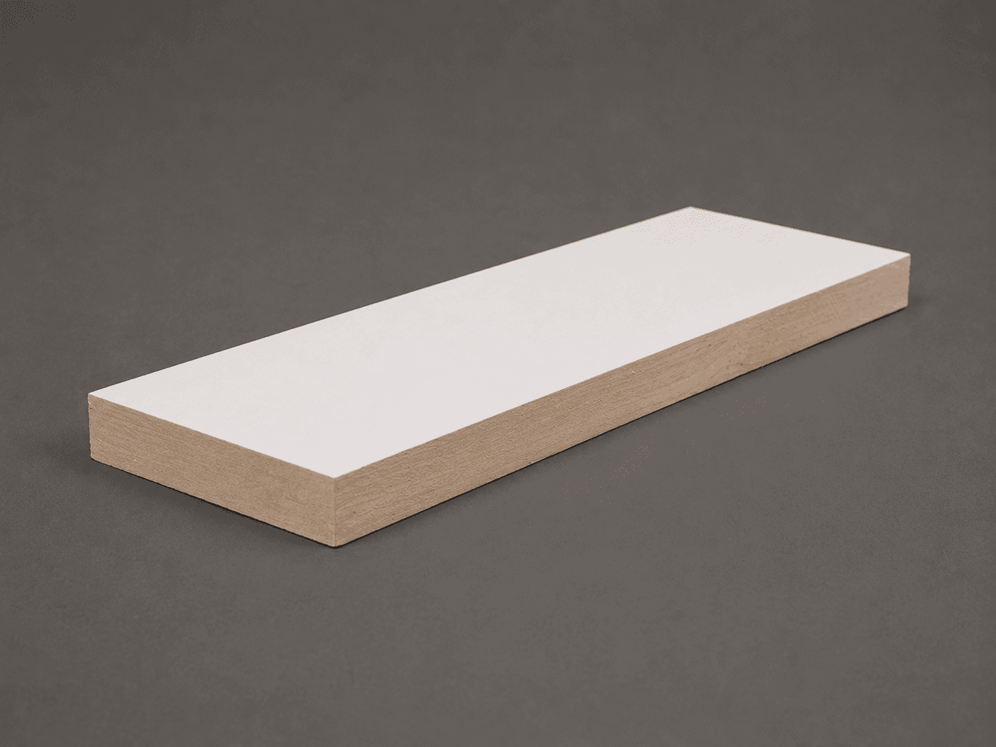 Primed white S4S board with square edges, cut end showing the bare wood